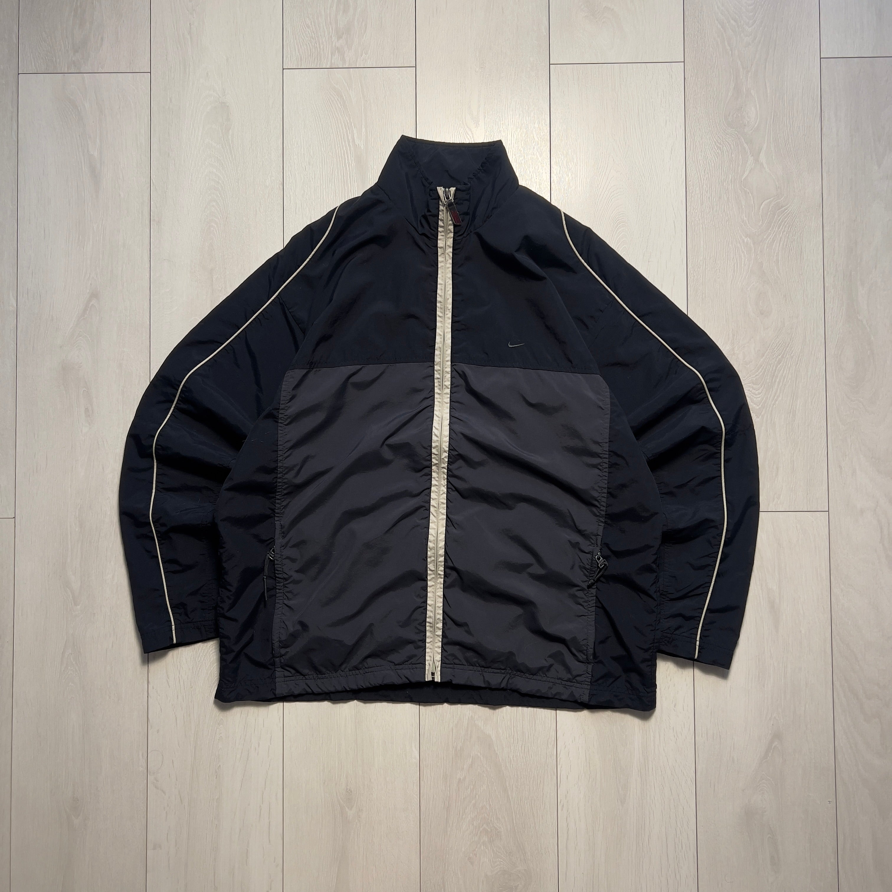 Nike vintage 90’ trackjacket (L)